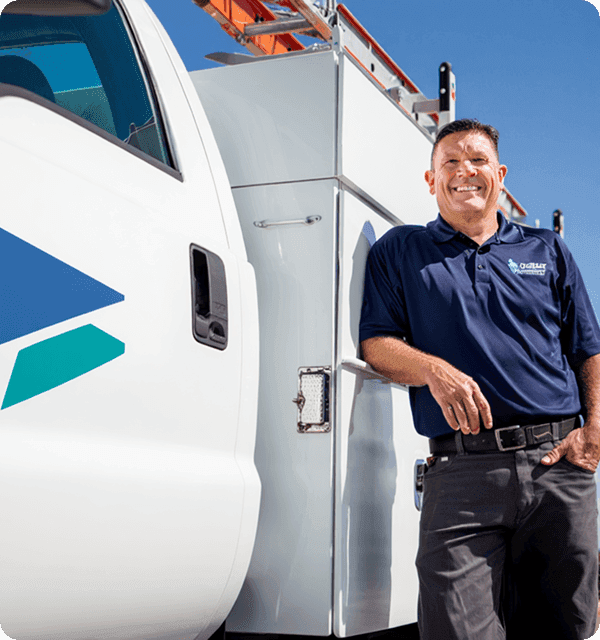 Contractor standing by truck